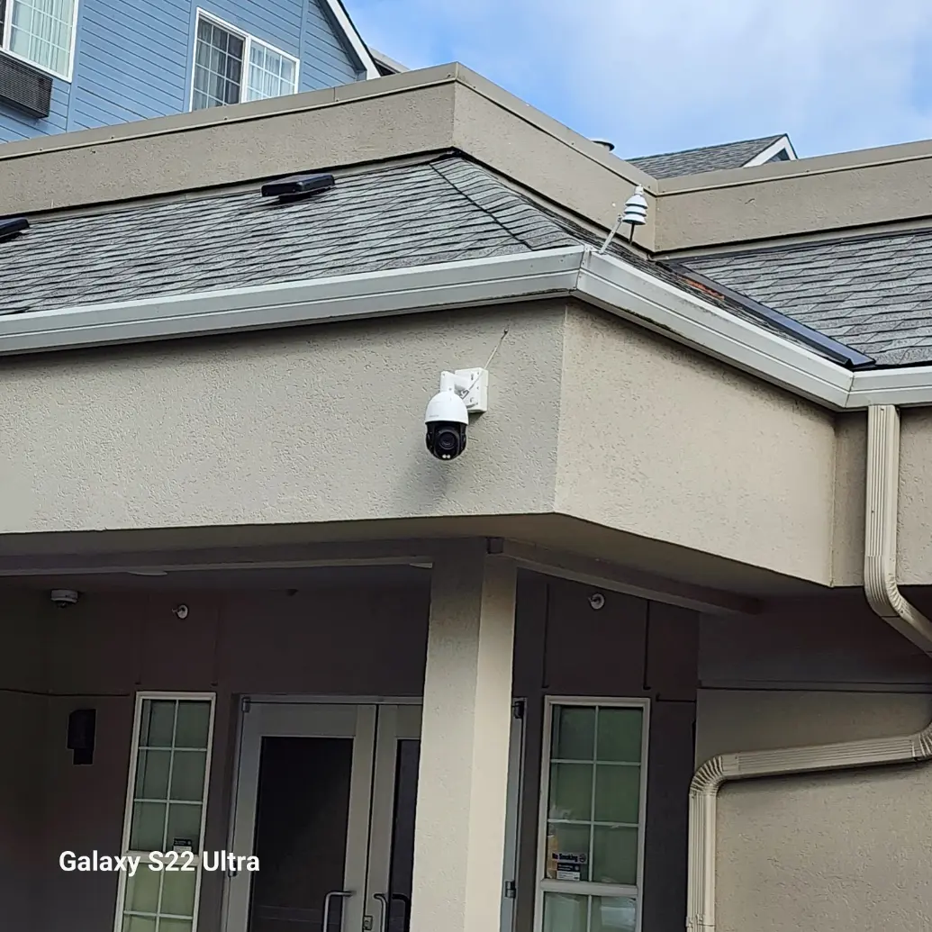 PTZ security camera overlooking a hotel entrance