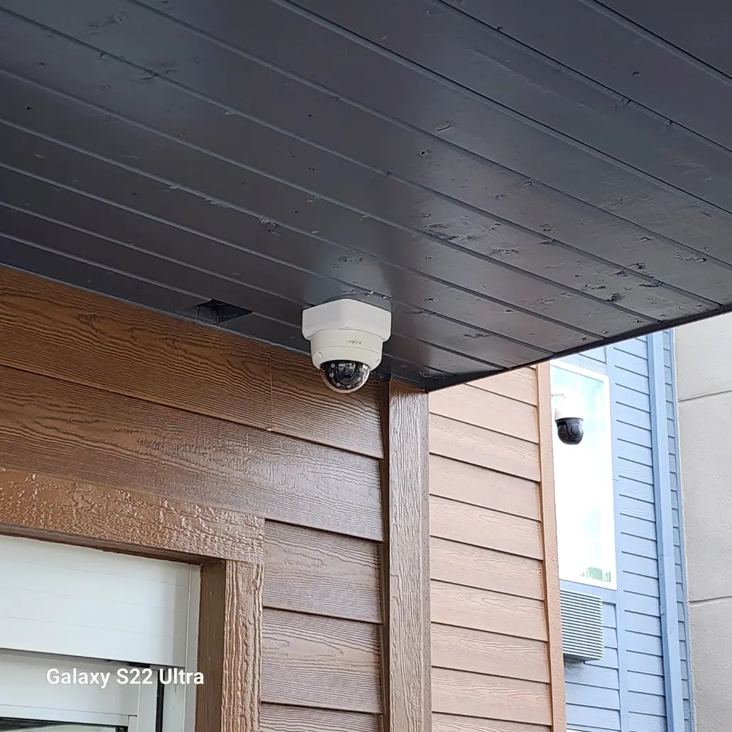 Reolink dome and PTZ cameras installed beneath an overhang